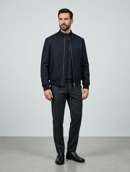 Formal bomber jacket on a model: tailored, structured, premium fabrics, refined details