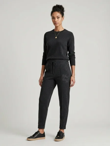 Luxury joggers on a model: refined, minimal, premium materials, impeccable tailoring