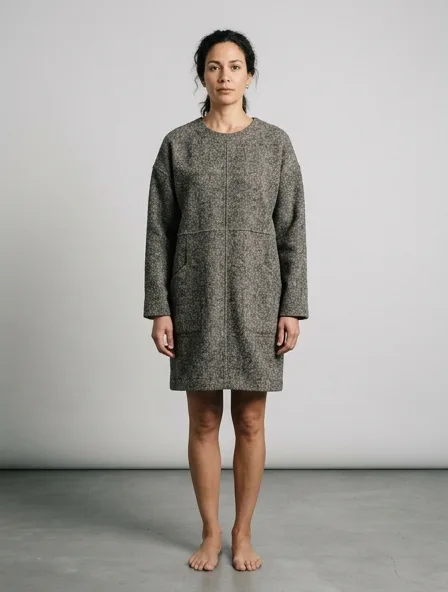 Tunic in wool tweed, on a model in a studio