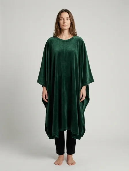 Poncho in cotton velvet, on a model in a studio